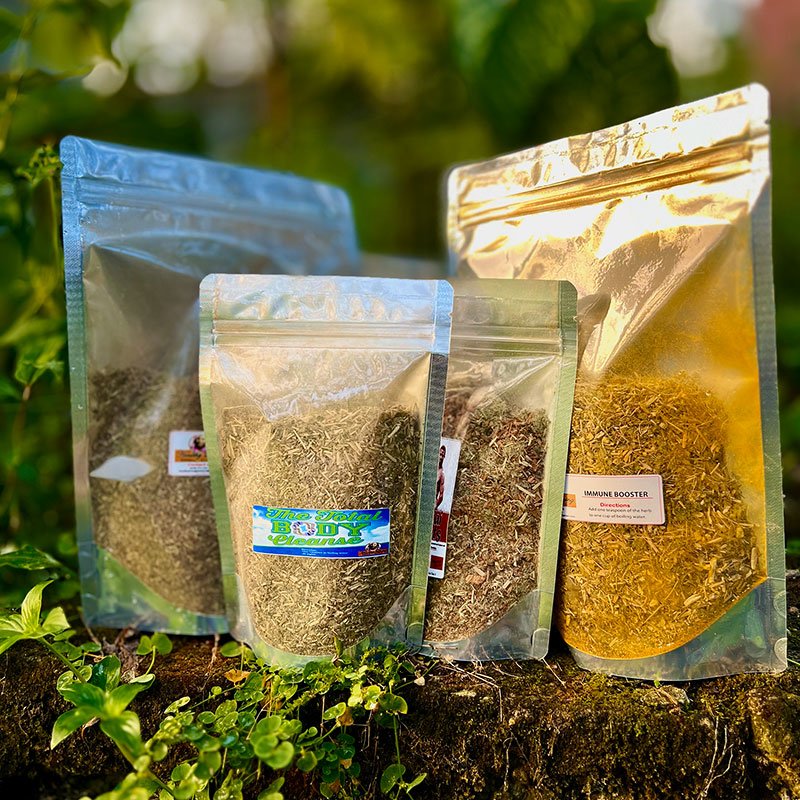 Four transparent resealable bags filled with different dried herbs or spices.