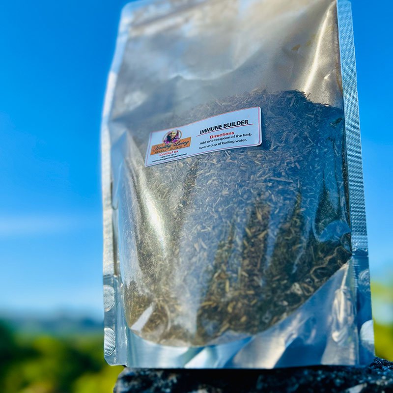 Silver pouch of dried oregano against a clear blue sky.