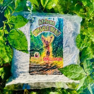 Bag of organic green coffee beans with vibrant packaging in natural greenery.