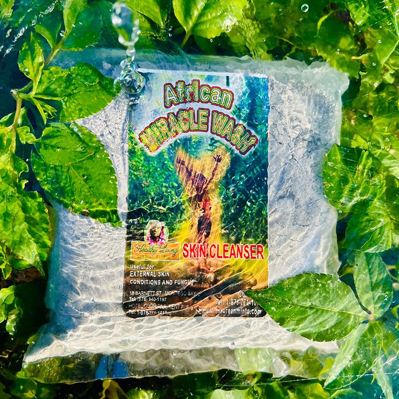 Bag of organic green coffee beans with vibrant packaging in natural greenery.