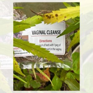 A sign advertising a vaginal cleanse with directions, partially obscured by plants.